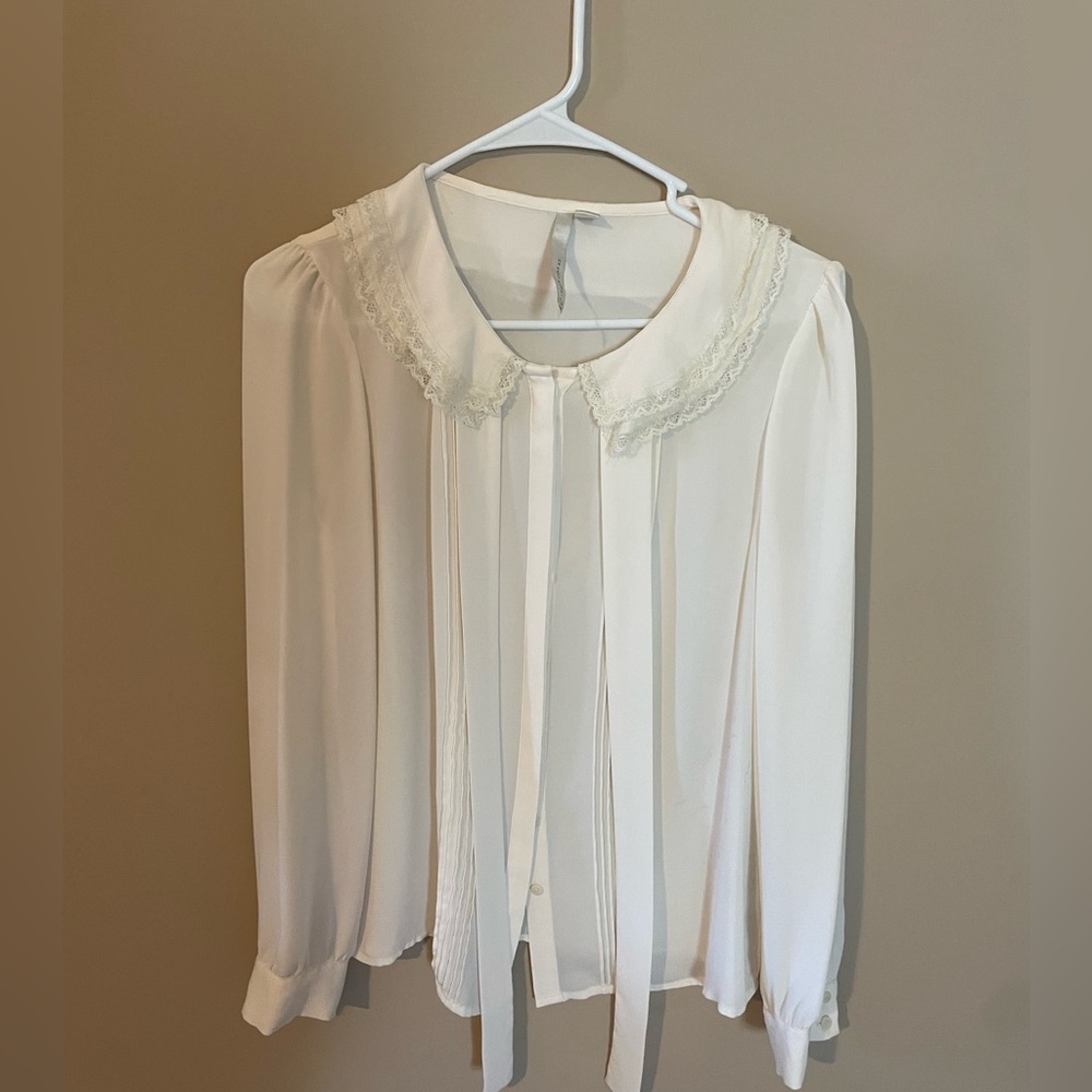Lauren Conrad - small, sheer, off white blouse.